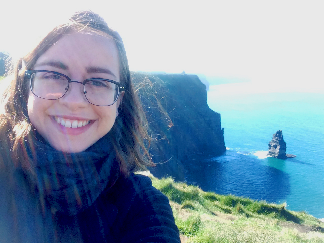 a photo of me at the Cliffs of Moher in County Clare, Ireland