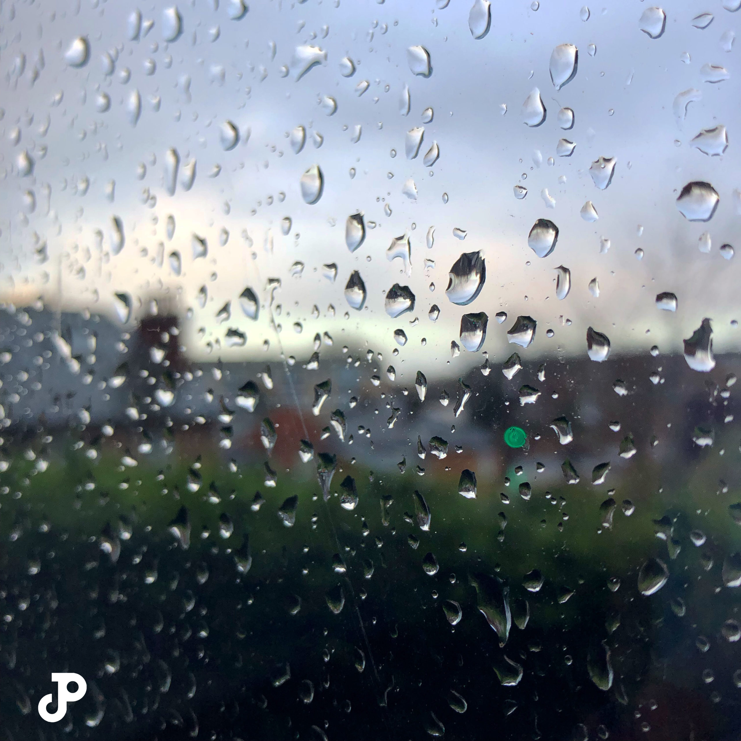 a windowpane splattered with raindrops