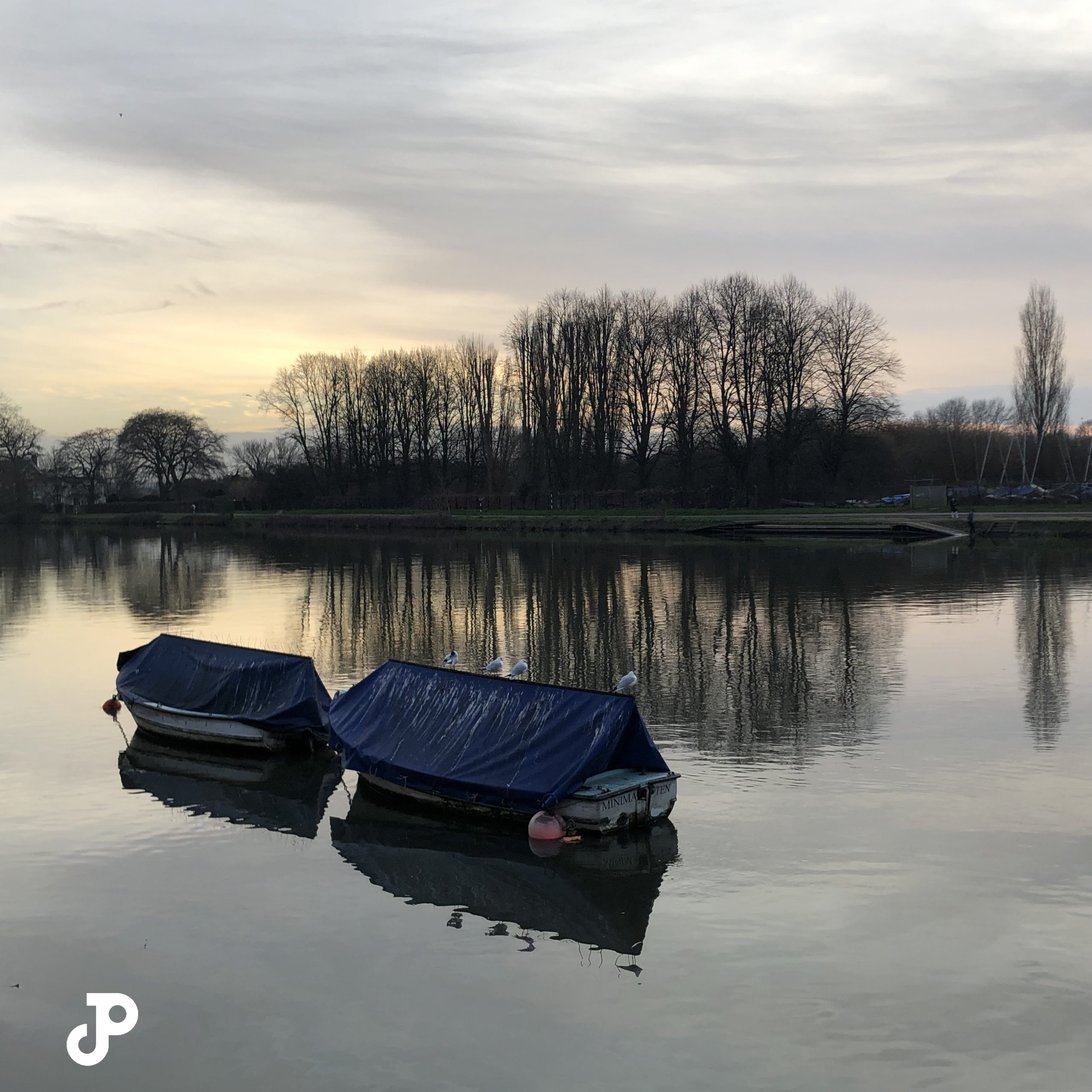 two small boats docked on the River Thames in Kingston Upon Thames