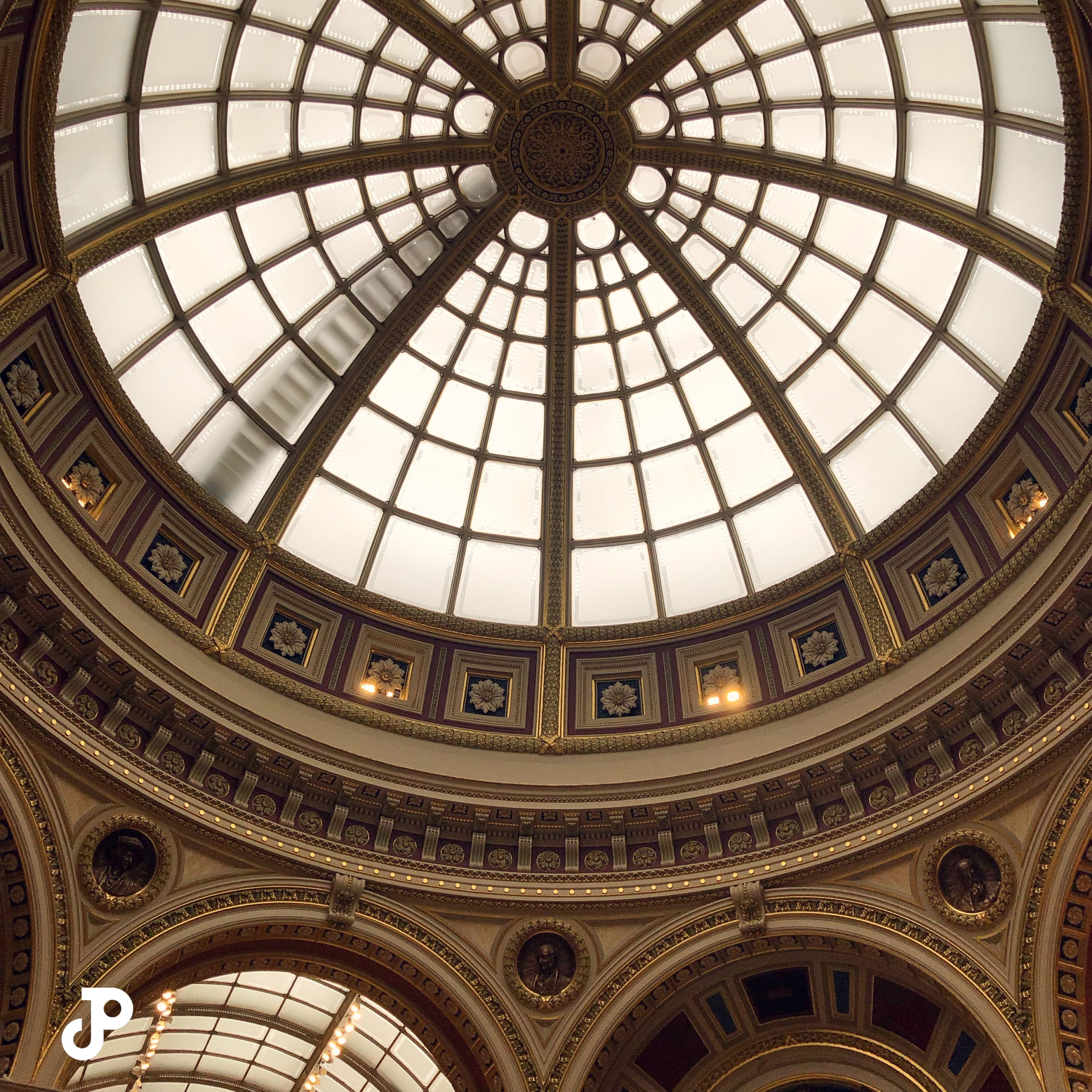 a view from below an ornate circular dome in the National Gallery in London