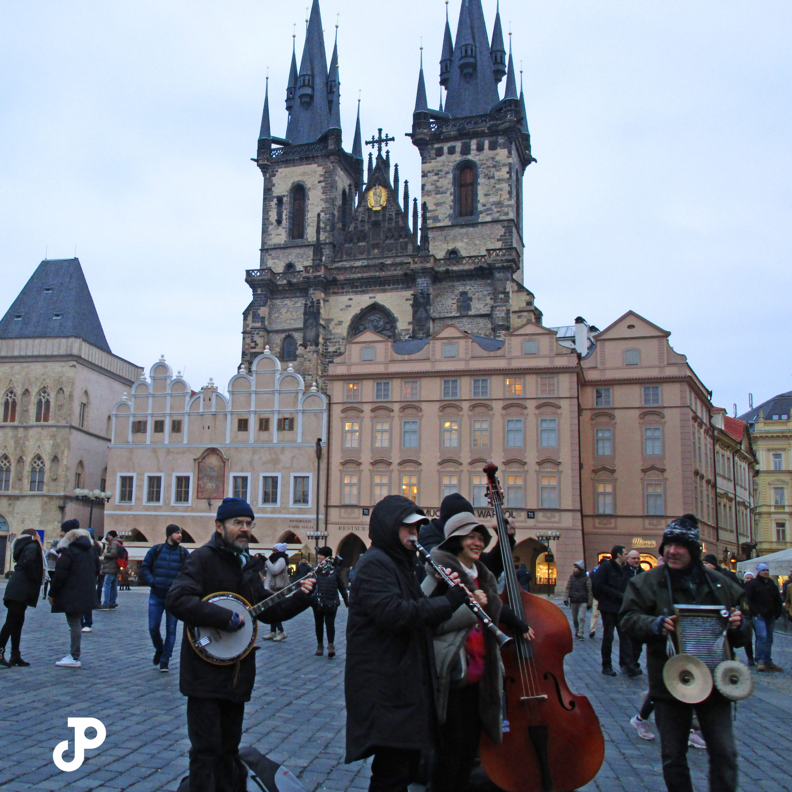 four musicians play in Old Town Square