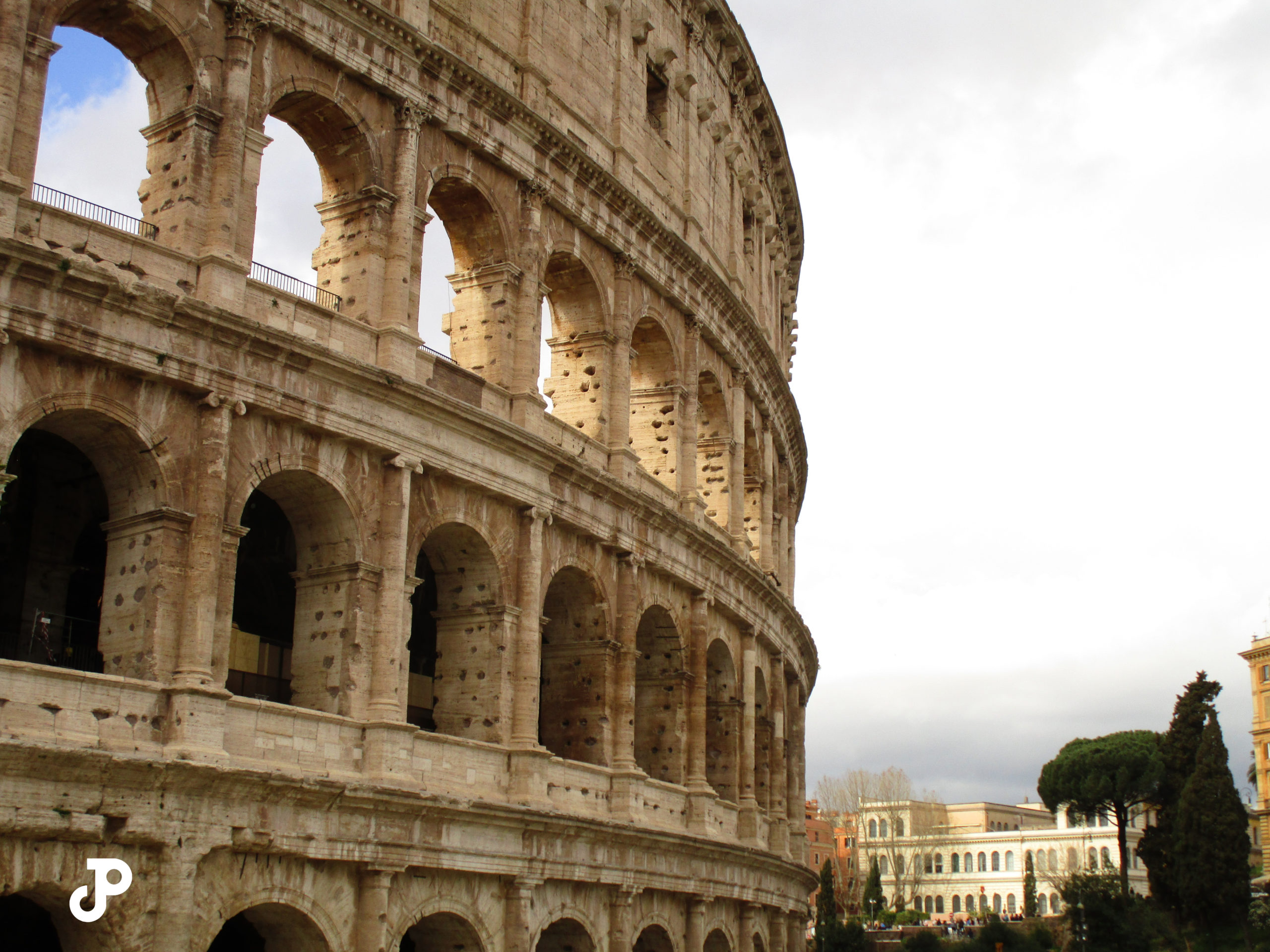 a side view of the Colosseum washed in bright sunlight