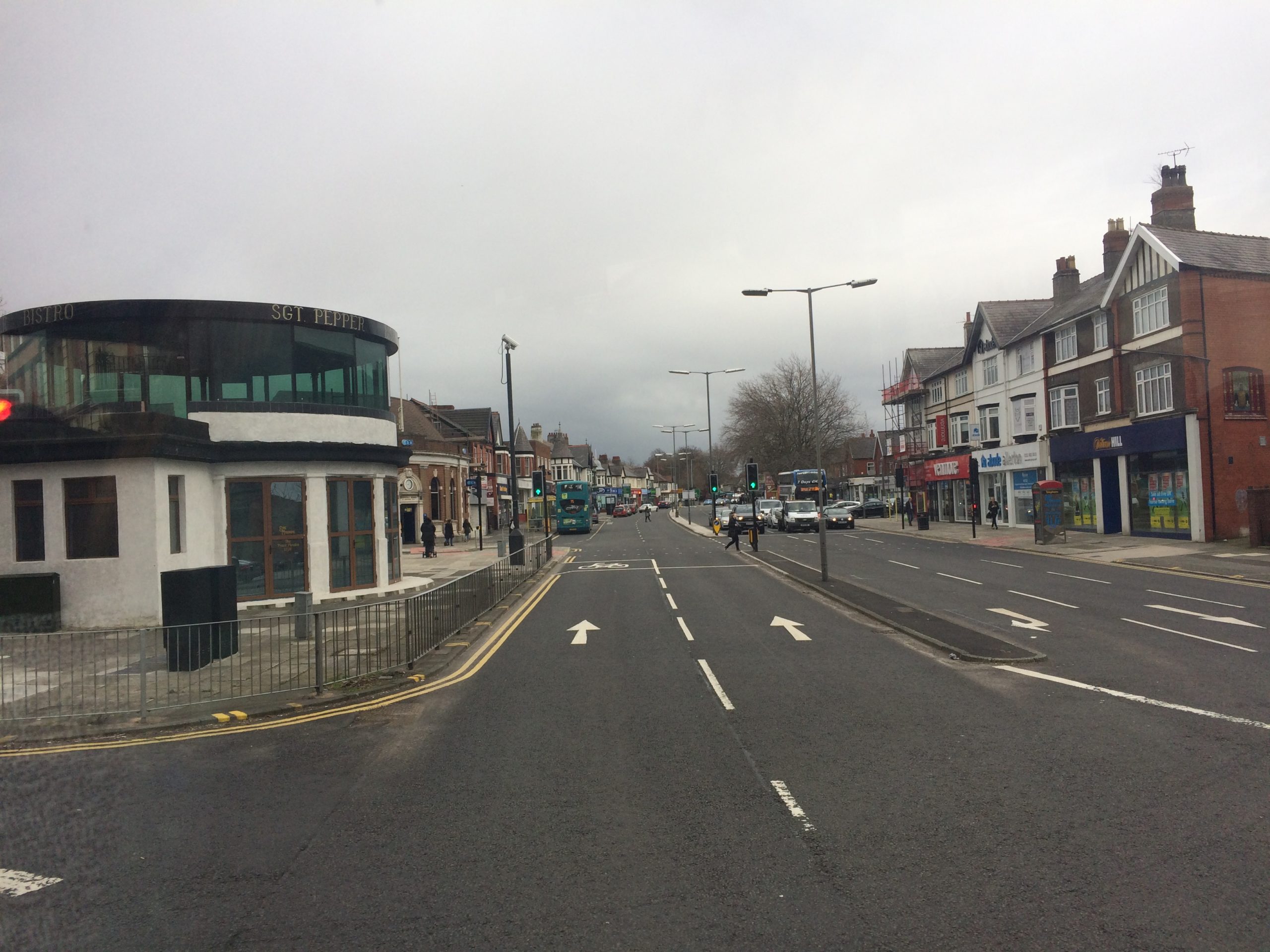 a photo of Penny Lane with the shelter in the roundabout visible to the left